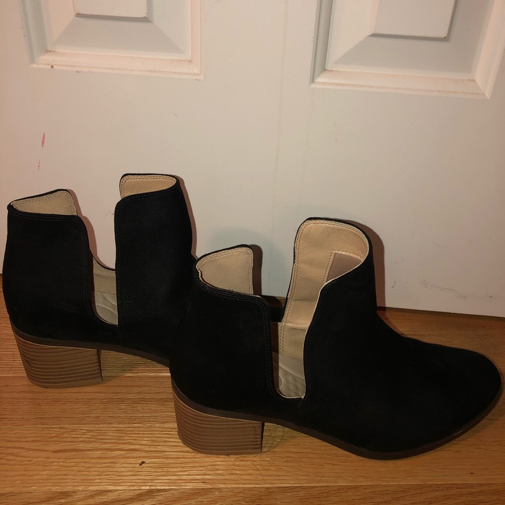 Black ankle booties with heel cutout